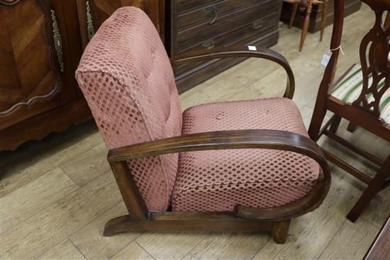 A pair of Art Deco simulated rosewood reclining armchairs